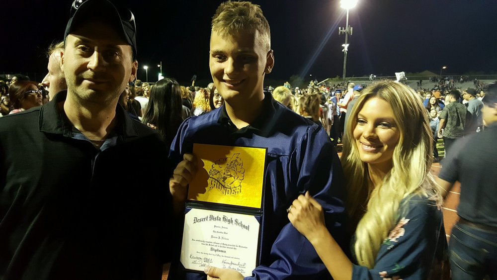 Devon, with his parents, Chad and Becky Nelson