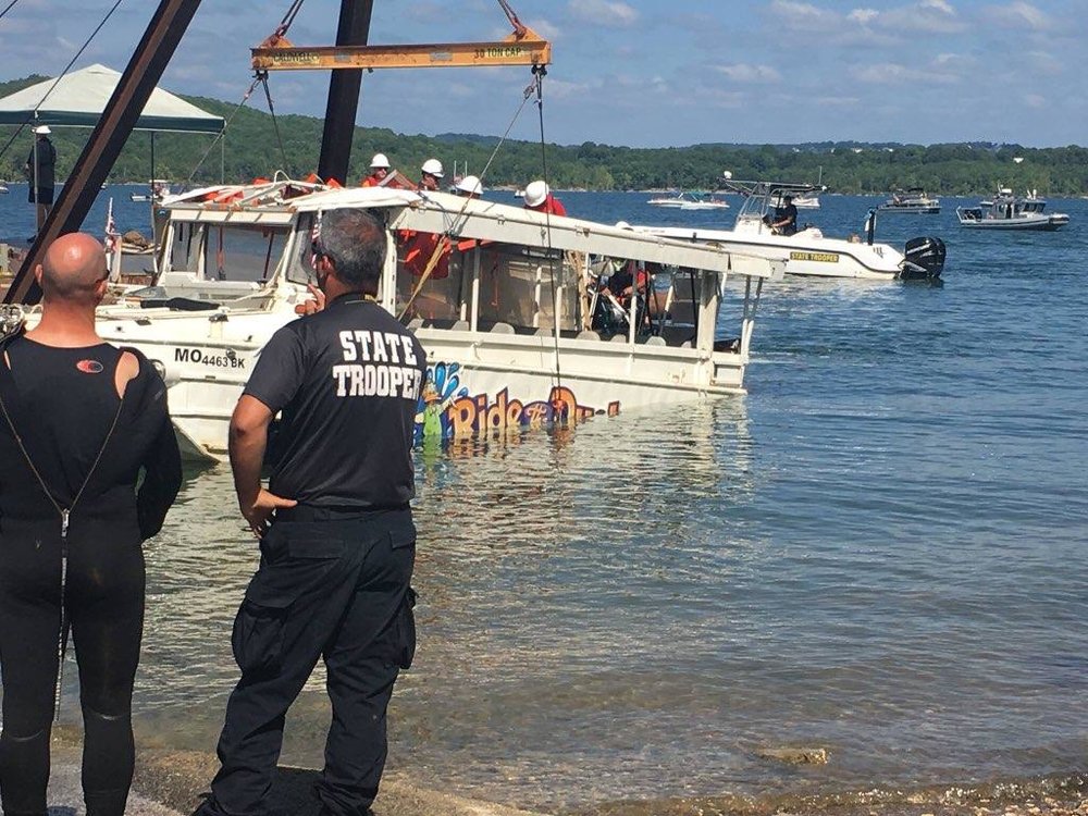 Billy Cole (left) watches as wreckage from the Branson, MO duck boat tragedy is lifted from the waters. Part of the Missouri Underwater Search and Recovery Team, Billy was one of the First Responders working to recover victims.