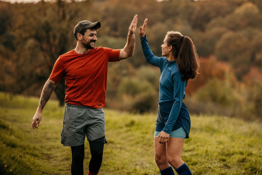 people high five in motivation for exercise, support, and trust.