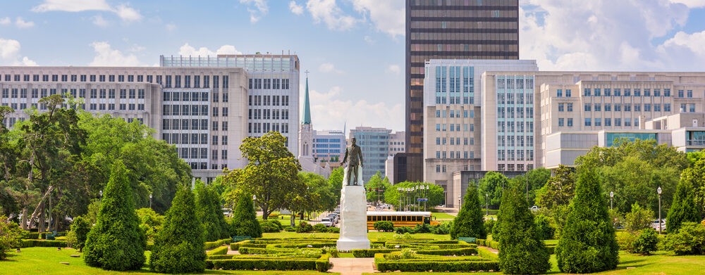 BATON ROUGE, LOUISIANA - MAY 12, 2016: The Huey Long memorial and the downtown Baton Rouge skyline.