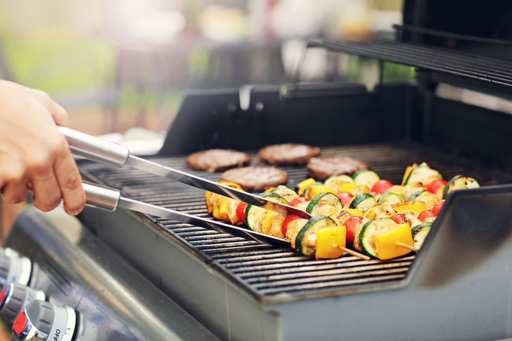 Closeup of grilled shashliks on grate