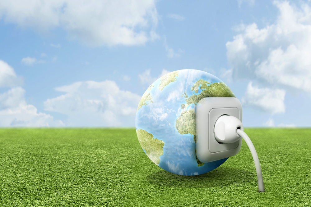 Electric plug into an earth power socket. Green Power Concept