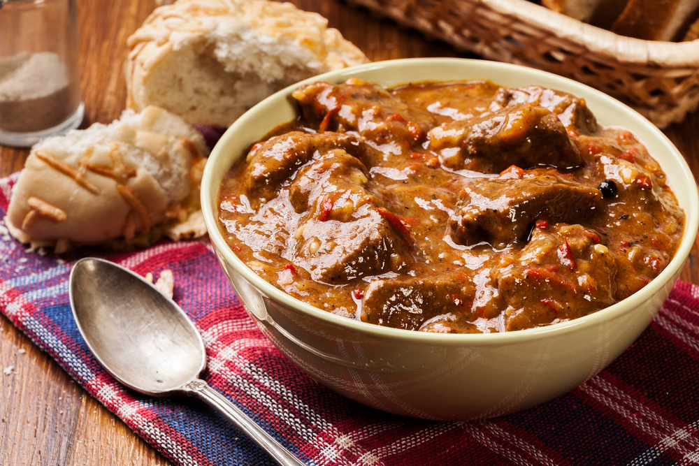 Beef stew served with crusty bread in a bowl